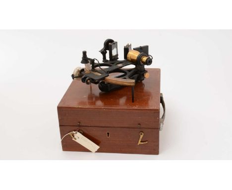 A 1940's brass and ebonised metal Husun Sextant by Henry Hughes &amp; Sun, Model number 57145, makers stamp to the frame, wit