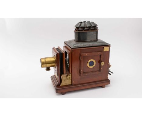 A Victorian magic lantern 'The British', by J.T. Chapman, Manchester, the lacquered brass lens housing with both 12in. and 7i