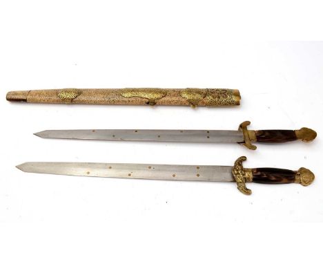 An early 20th Century Chinese Jian double sword, the 41cms blades with brass dot design, on brass and horn hilt, fitted a bra