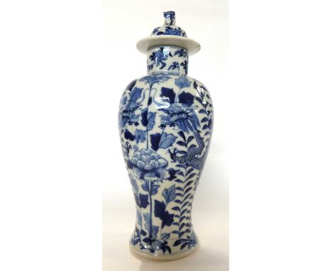 A 19th century Chinese porcelain vase and cover with blue and white design iof dragons in Kangxi style30cm highhairline to va