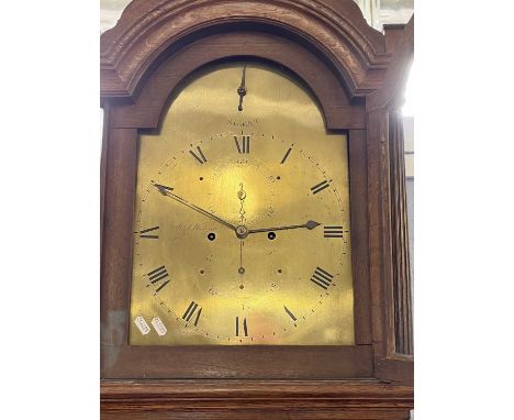 Saddleton, Lynn - A Georgian long case clock with arched brass dial and an eight day movement, set in an oak case with arched