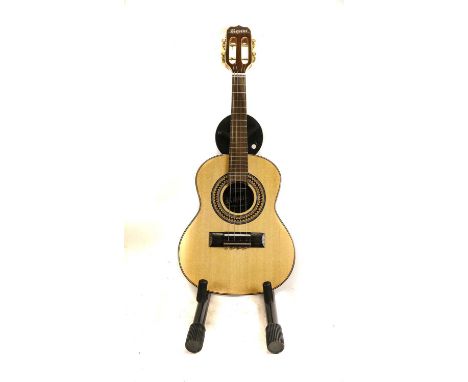 four metal strings, two wound two solid, guitar shaped body, 19 frets, overall length 24 1/2", scale length 13 3/8" in soft c