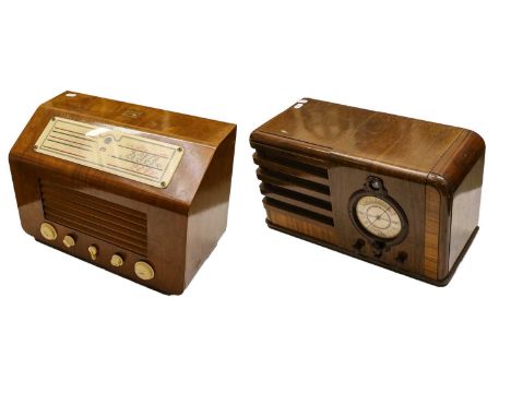 an HMV Type 5201 with raised dial and cream knobs; a Pilot three-band receiver with curved fretted wood case and magic eye tu