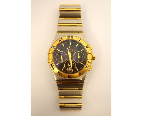 GENTLEMAN'S 'OMEGA CONSTELLATION' BI METAL QUARTZ CHRONOGRAPH WRISTWATCHwith a black dial and gold coloured baton markers, da