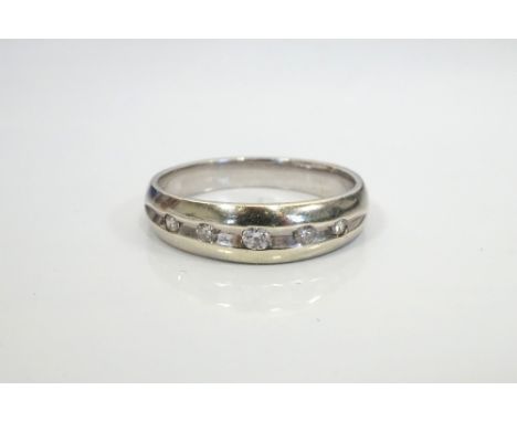 GENTLEMAN'S DIAMOND SET RINGin nine carat white gold, the five graduated channel set diamonds totalling approximately 0.25cts