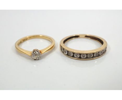 DIAMOND SOLITAIRE RINGthe diamond approximately 0.1cts, and an illusion set diamond half eternity ring, both on gold shanks, 