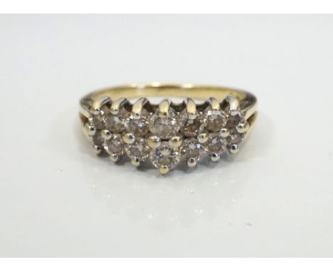 DIAMOND CLUSTER RINGon fourteen carat gold shank, the diamonds in stepped setting totalling approximately 0.6cts, ring size N