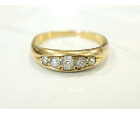 GRADUATED DIAMOND FIVE STONE RINGon gold shank, the diamonds totalling approximately 0.3cts, ring size Q