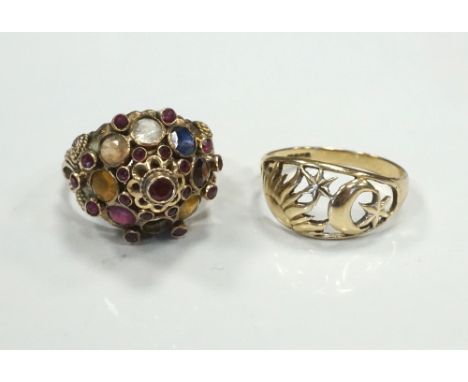 MULTI GEM SET RING
the elaborate setting with ruby, sapphire, citrine, smoky quartz and garnet, the shank marked eighteen car