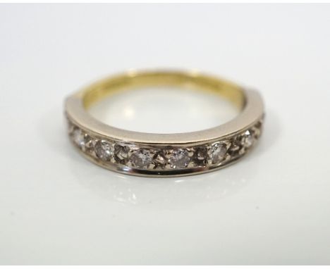 DIAMOND HALF ETERNITY RINGin eighteen carat gold, the nine diamonds totalling approximately 0.35cts, ring size L-M