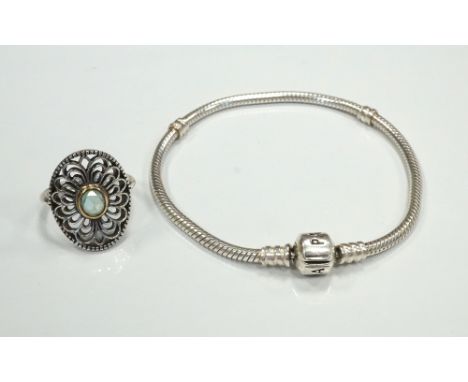 PANDORA MOMENTS SILVER CHARM BRACELETwith barrel clasp, together with a Pandora gem set silver ring (2)