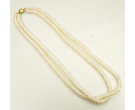 DOUBLE STRAND CULTURED PEARL NECKLACEwith circular nine carat gold clasp, approximately 44cm long