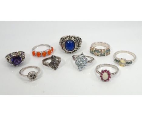 SELECTION OF NINE SILVER RINGScomprising a fire opal five stone ring, a blue glass set college ring, an RAF sweetheart ring, 