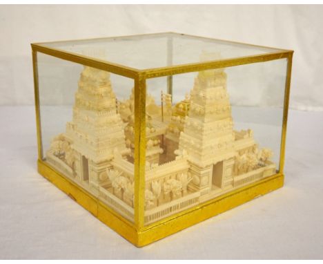 ASIAN BALSA WOOD MODEL OF A TEMPLEpossibly Hindu, in glazed case, the case size 23.5cm high x 30.5cm wide x 30cm deep