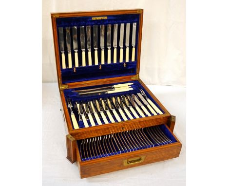 1920's OAK CASED CUTLERY CANTEENwith hinged lid, lower drawer, folding front ends and brass carrying handles, fitted velvet l