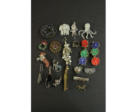 A collection of costume jewellery, including diamante brooches, a silver sweetheart brooch, a pair of Lucite floral design ea