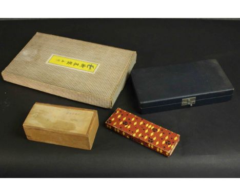 A collection of vintage games, including a vintage boxed set of Go, a set of acrylic chips, a chess set and an abacus. H.4 W.