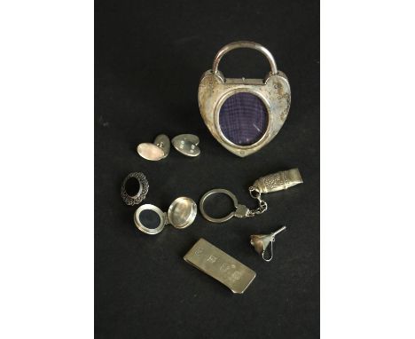 A collection of silver items, including a pair of silver cufflinks, a Douglas Pell money clip, a Goldsmiths &amp; Silversmith