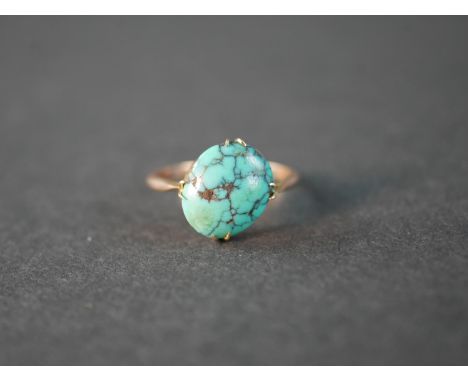 A Victorian turquoise and 9 carat rose gold dress ring, set with an oval cabochon turquoise with an approximate carat weight 