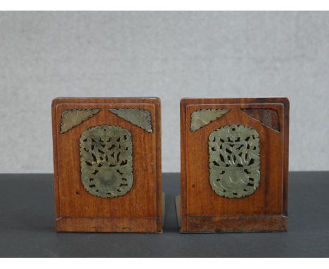 A pair of Chinese hardwood and brass bookends, set with carved and pierced jade detail. H.14 W.13 D.13cm 