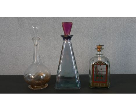 A Holmegaard Danish Advent decanter by Michael Bang along with an Italian Art Deco style decanter and a early 20th century de