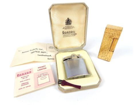 A vintage gold plated Dunhill rectangular shaped lighter, with bark effect decoration, bearing marks to base, 6.5cm long, tog