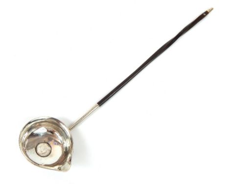 A Georgian silver and coin inset toddy ladle, turned whalebone handle, terminating in a plain silver finial,  32cm long.