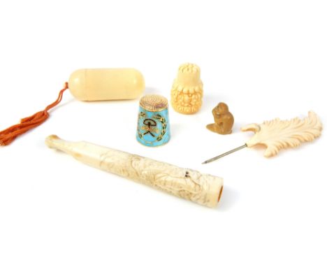 Japanese ivory cigarette holder with glass eye dragon detail, & other ivorine items & an enamel thimble.