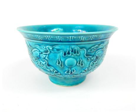 Chinese rice bowl, turquoise glaze, relief decoration of dragons and flaming pearl over the seas, six blue ink character mark