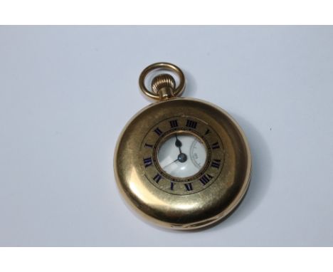 A HALLMARKED 18 CARAT GOLD MANUAL WIND HALF HUNTER POCKET WATCH, having plain outer casing, enamel chapter ring with Roman nu