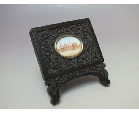 A 19TH CENTURY ANGLO INDIAN MINIATURE PAINTING depicting Jama Masjid Deli, set within a carved ebonised wooden frame with eas