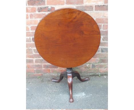 A GEORGIAN MAHOGANY PEDESTAL TABLE, the one piece circular top with original snap lock mechanism, raised on a vase turned col