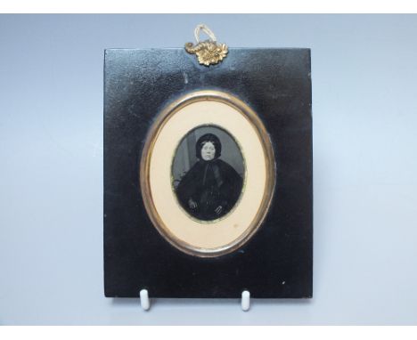 A 19TH CENTURY AMBROTYPE PORTRAIT IMAGE OF A FEMALE DRESSED IN BLACK ATTIRE, overall H 13.5 cm