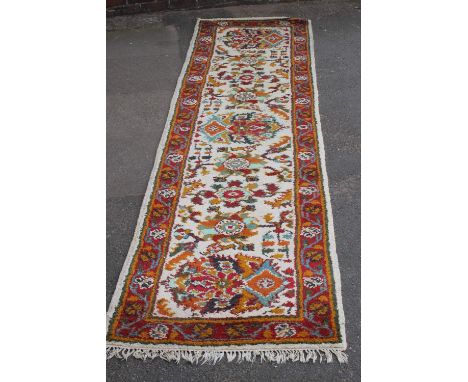A NORTH AFRICAN WOOLLEN CARPET, 360 x 95 cm