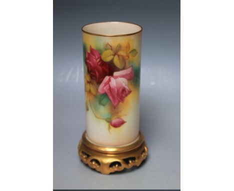 A ROYAL WORCESTER BLUSH IVORY VASE, painted with roses, signed M. Hunt, raised on a pierced gilt base, H 16 cm