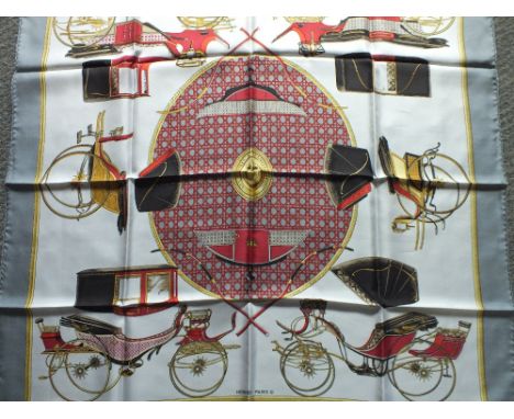 A VINTAGE HERMES 'LES VOITURES A TRANSFORMATION' SILK SCARF, designed by Francoise de la Perriere, the equestrian themed patt