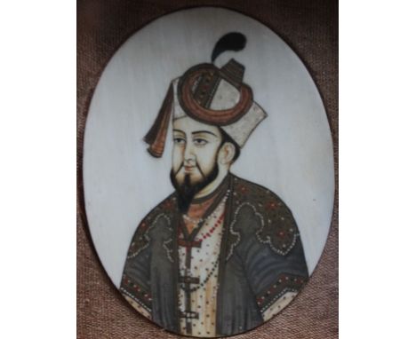 A LATE 19TH / EARLY 20TH CENTURY OVAL ANGLO-INDIAN PORTRAIT MINIATURE of an Indian gentleman, watercolour, unsigned, framed a