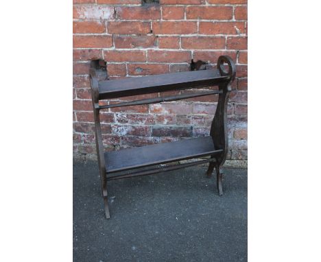 AN OAK 1920'S TWO TIER BOOK TROUGH, with cut-out handles and turned stretcher, H 81.5 cm, W 69 cm