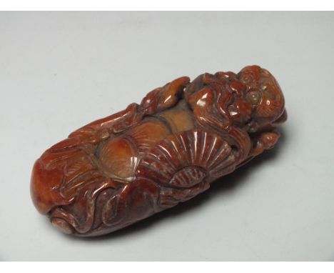 A LATE 19TH / EARLY 20TH CENTURY CHINESE BROWN JADE CARVING OF A MYTHICAL FIGURE, L 10 cmNote: Origin or treatments of this j