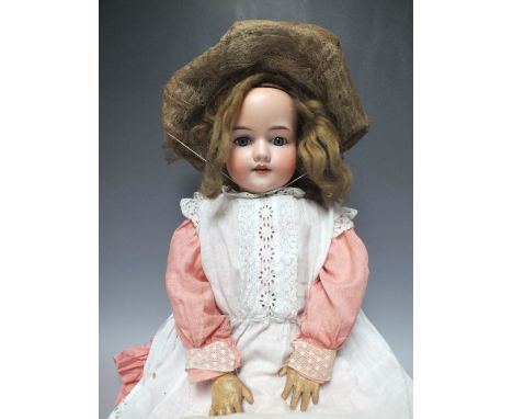 AN ARMAND MARSEILLE BISQUE HEADED DOLL MARKED GERMANY 390 A 9 M, open mouth, weighted blue eyes and jointed composition body 