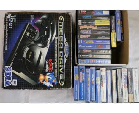 Sega Mega Drive 16 bit game console with a selection of games including Worms, Sonic, Sonic 2, Ariel the Little Mermaid, Real