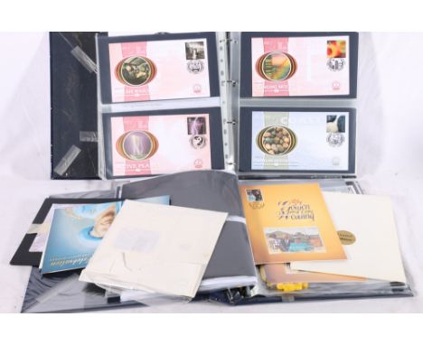 An album containing approximately 105 Benham silk Millennium Collection first day covers, an album containing Royal Collectio