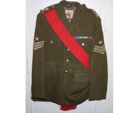 British Army khaki green dress uniform jacket having Polikoff Universal Ltd label with Welsh Guards staybrite buttons by Gaun