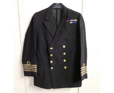 British Royal Navy dress uniform jacket having Gieves Ltd "QMDR Osboure K 8 18 RN" with brass naval buttons, bullion wire cuf