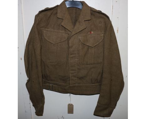 British Army khaki green dress uniform jacket having Sunderland and Sons Ltd label "Battledress Blouse Serge, size 12, MAR 19