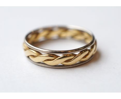 TWO TONE EIGHTEEN CARAT GOLD RING
with rope twist decoration, ring size J-K, approximately 2.8 grams
