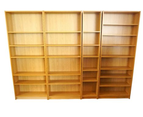 FOUR LIGHT OAK EFFECT WALL UNITS
each with adjustable shelving, all 202cm high, three 80.5cm wide and one 40.5cm wide (4)