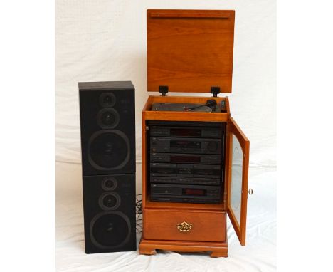 JVC HI-FI SYSTEM
contained in a glass fronted cabinet with a record player, CD player, twin cassette deck, graphic equalizer,