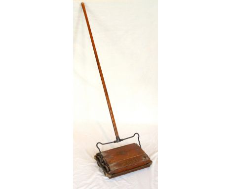 VINTAGE 'EWBANK' CARPET SWEEPER
with a turned wooden handle above a wood and metal body labelled 'Federation No1'