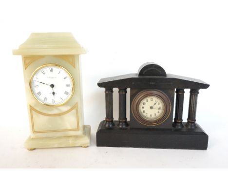 VICTORIAN BLACK SLATE MANTLE CLOCK
with a shaped top above a circular silvered dial with Arabic numerals, flanked by two pair
